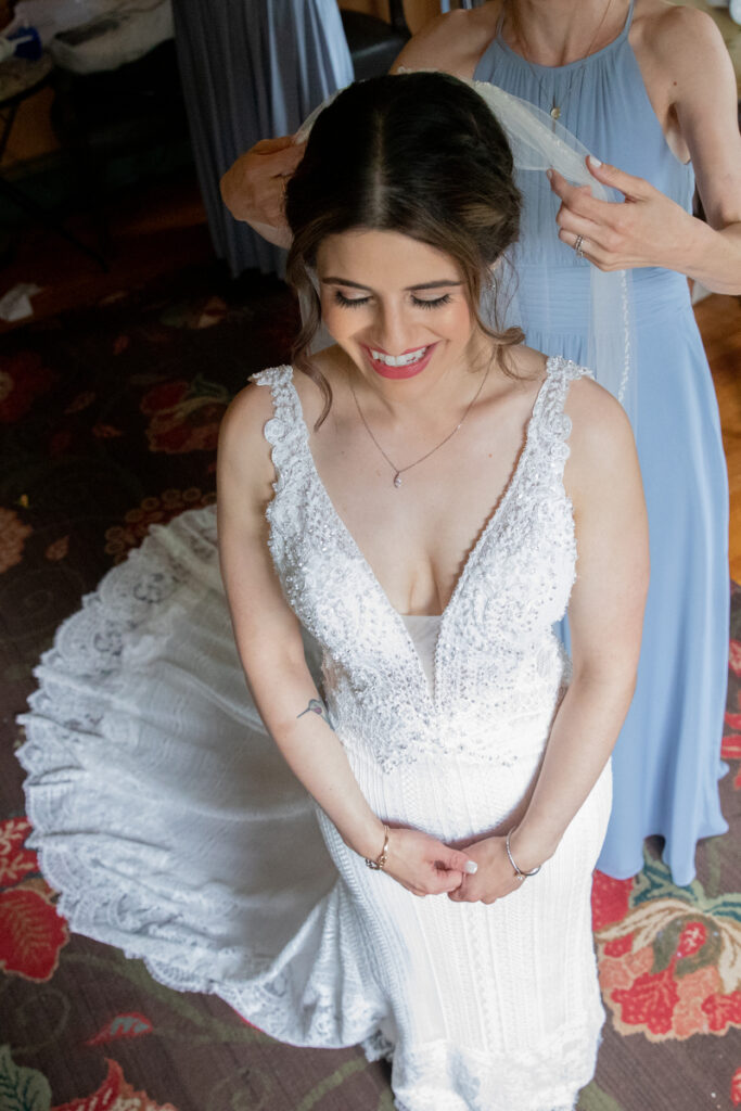 A groom twirls his bride in a garden Rockland County wedding photographer Milestone Images